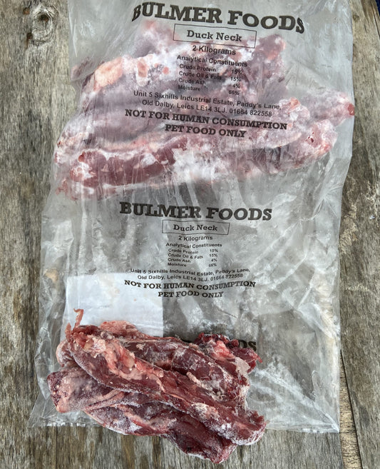 A bag of frozen, raw duck necks branded as Bulmer Foods for pet food