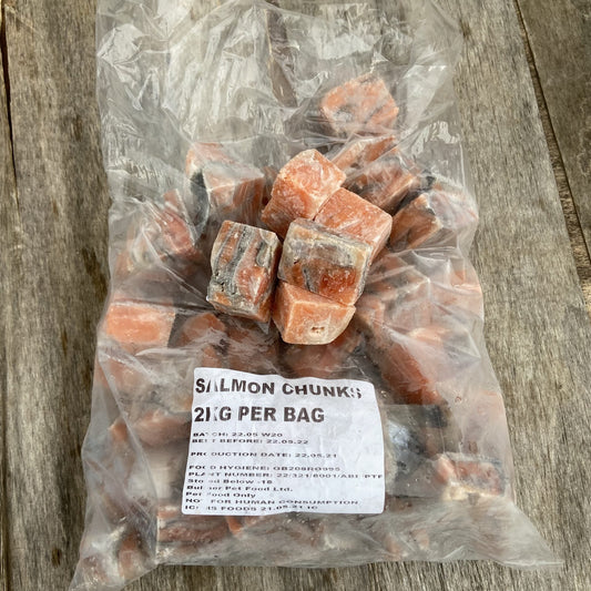 A 2kg bag of raw frozen salmon chunks with a label on it