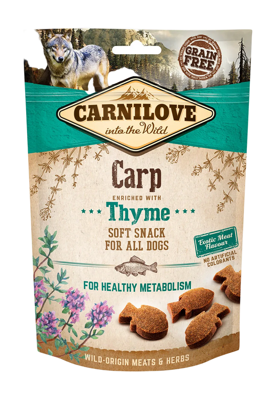 Carnilove dog snack package with a wolf illustration with a mountain & forest background