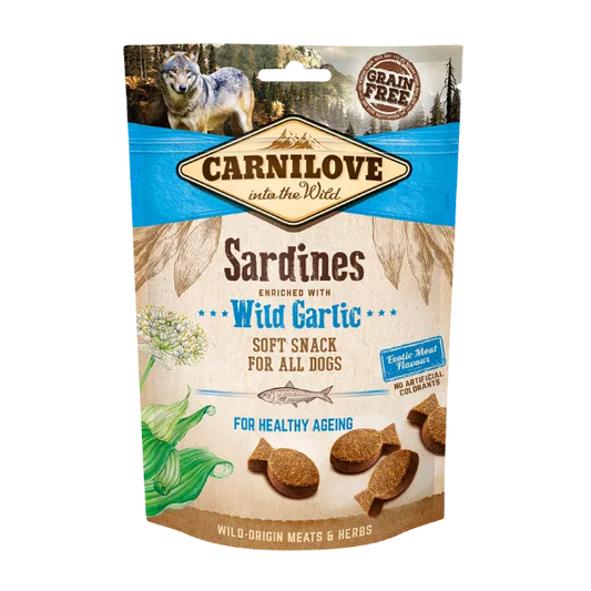 Image of the front of the 200g pouch of Carnilove Semi-Moist Soft Sardine with Wild Garlic dog treats. Back ground is of forests, mountains and a Wolf illustrating the wild ingredients.