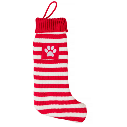 Red and white striped dog sweater with a paw print on a white background