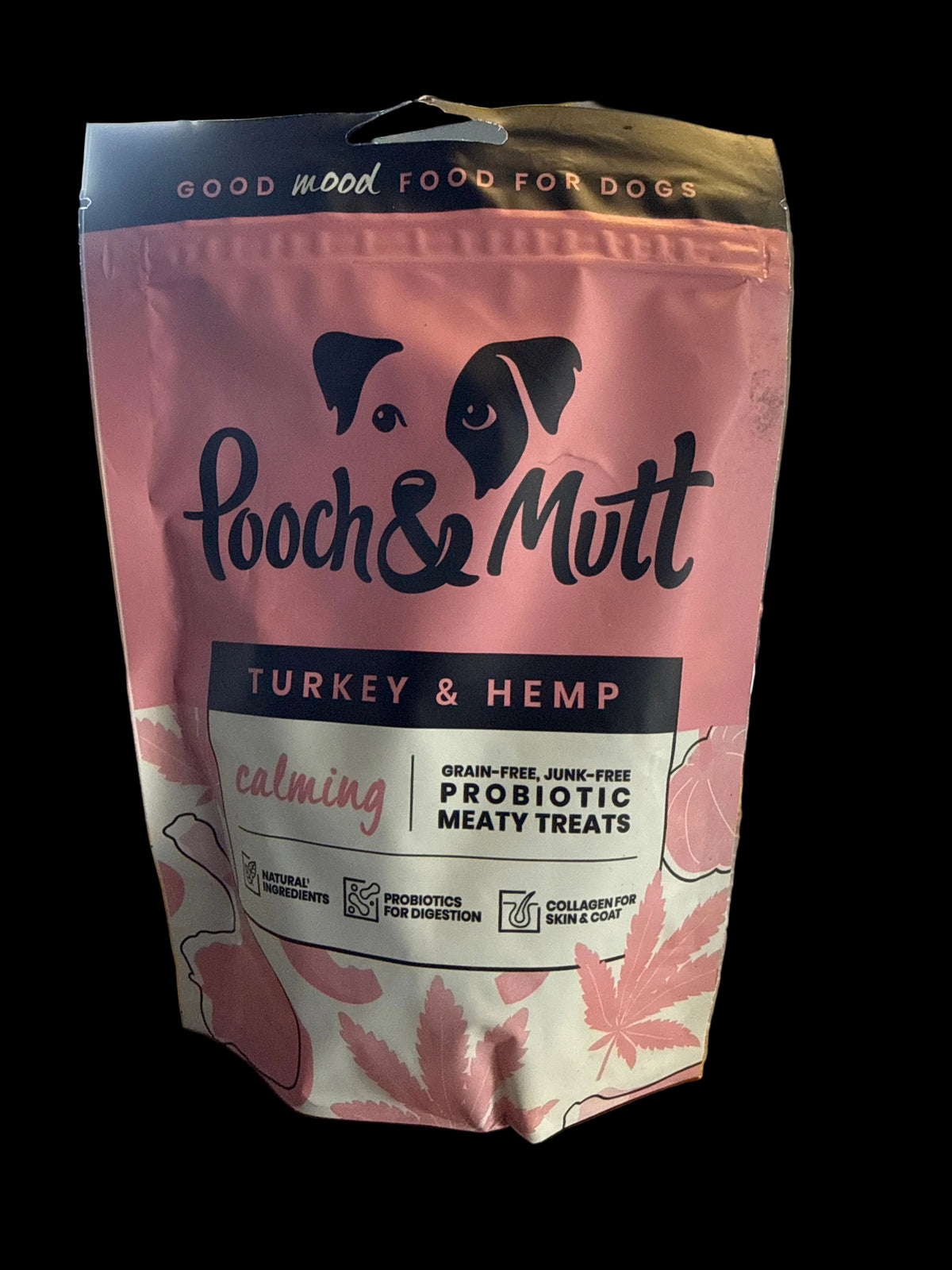 A pink stand-up pouch of Pooch & Mutt calming Turkey & Hemp probiotic meaty treats for dogs