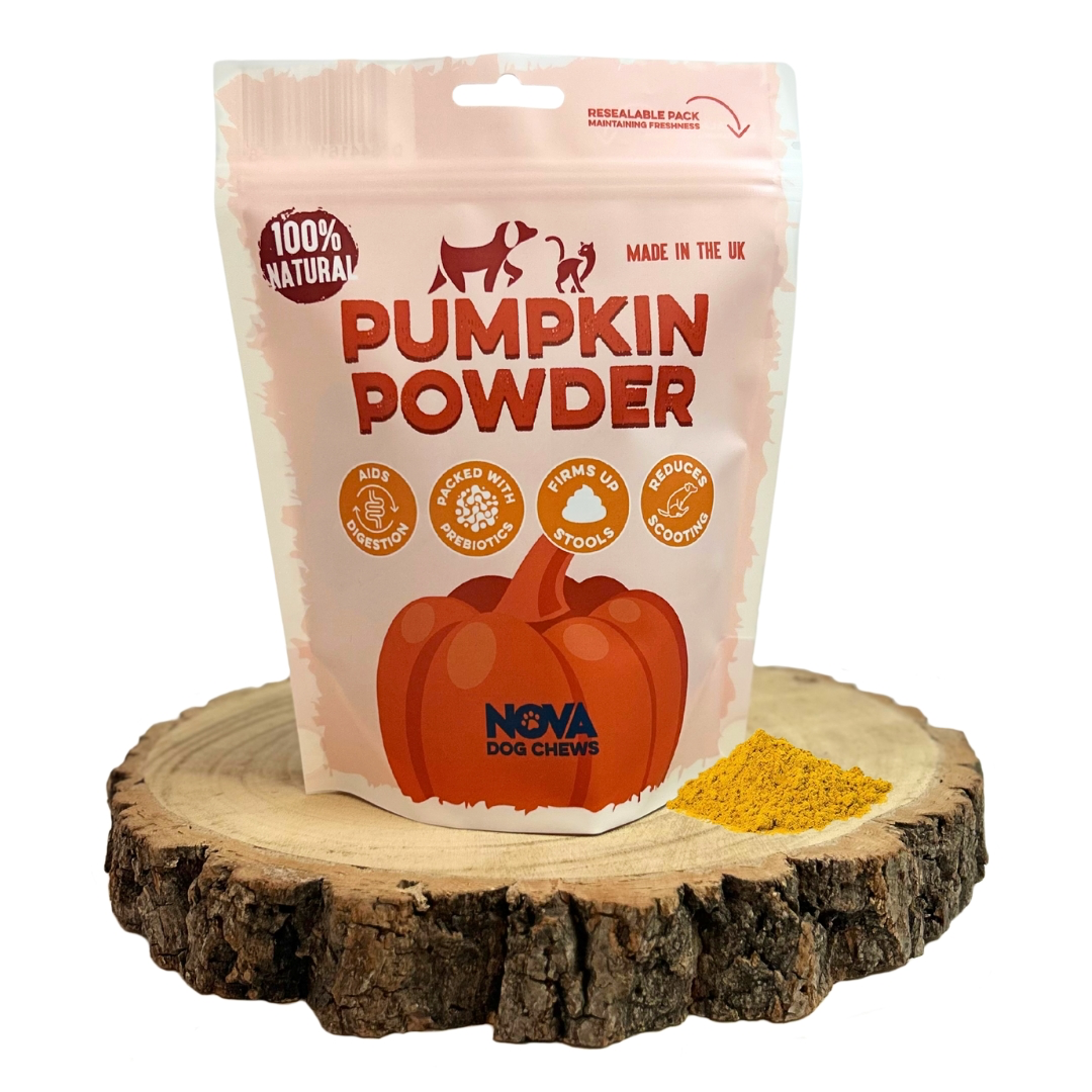 Bag of Nova Dog Chews pumpkin powder on a wooden block with pumpkin powder spilling out.