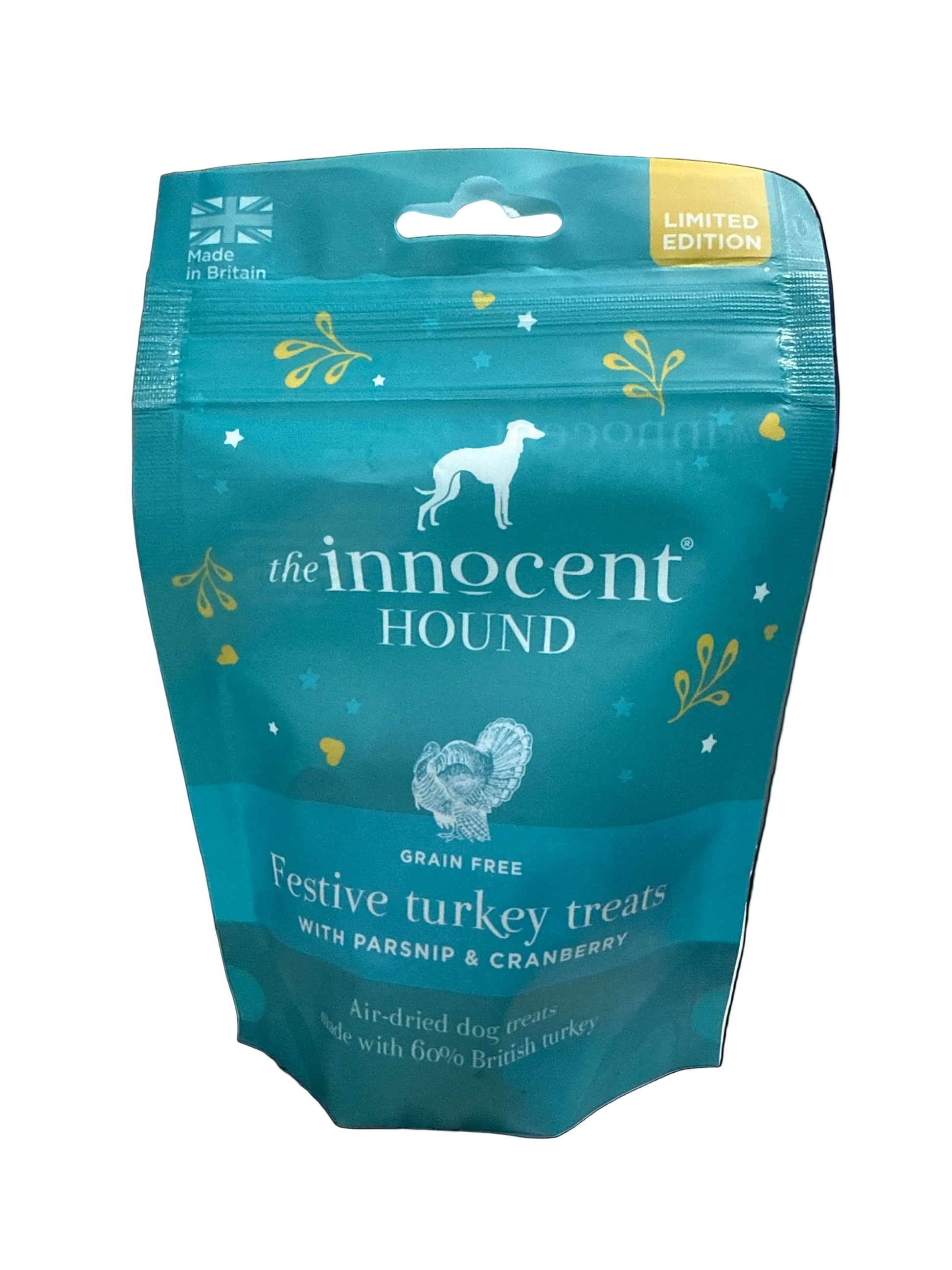 Teal package of 'The Innocent Hound' dog treats on a cluttered background