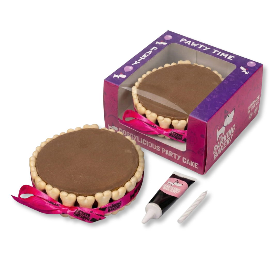 The Barking Bakery plain carob Pawty Cake with its box, icing pen and candle